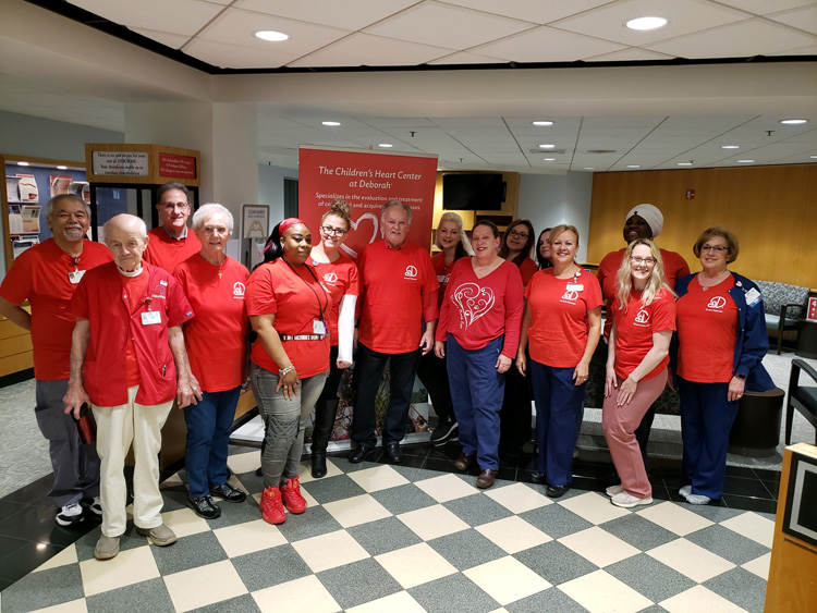 Group of Deborah Heart and Lung Center employees posing for the bi-annual Sudden Cardiac Arrest event.