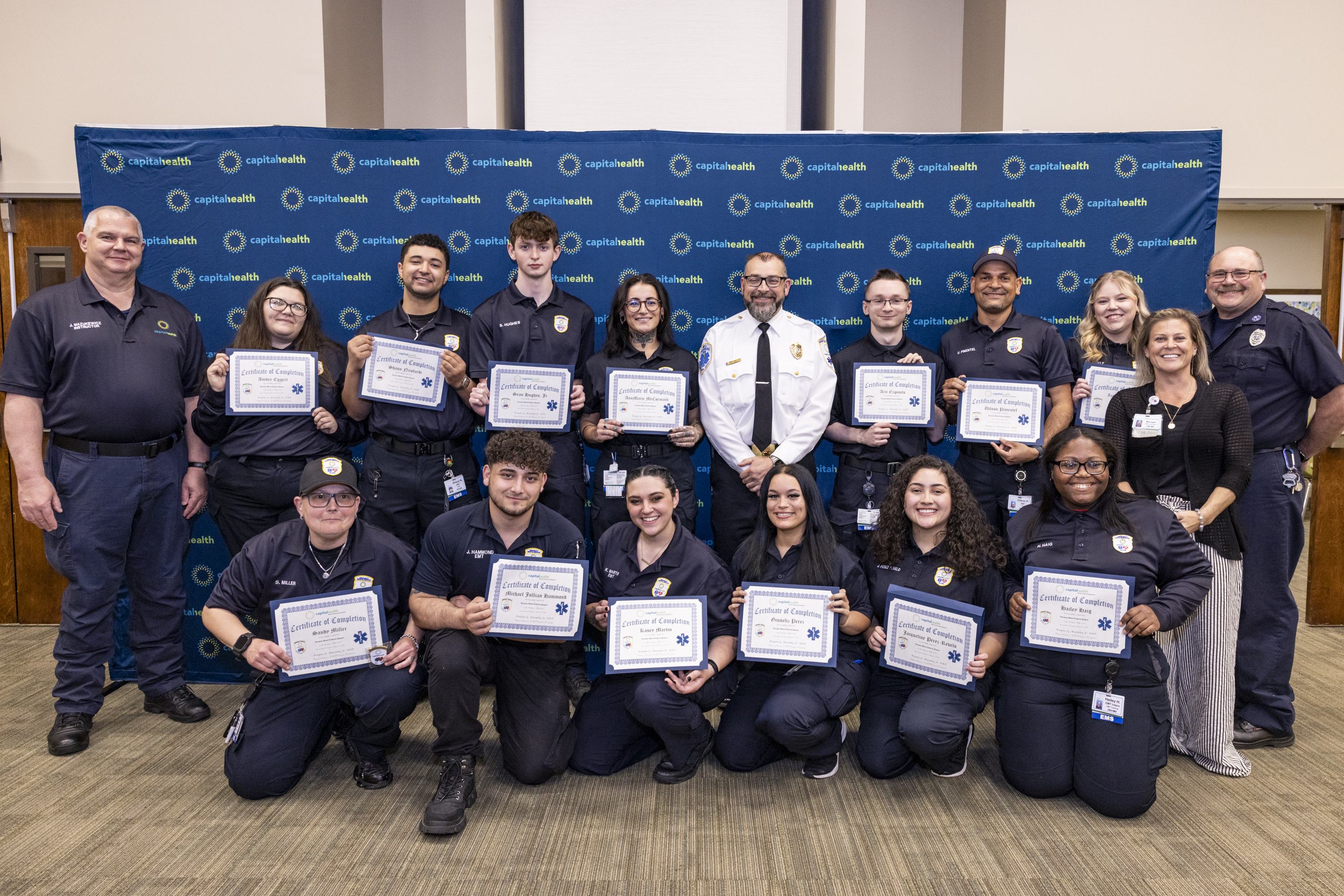 Workforce and Employee Wellness featuring an image of Capitol Health EMT graduates