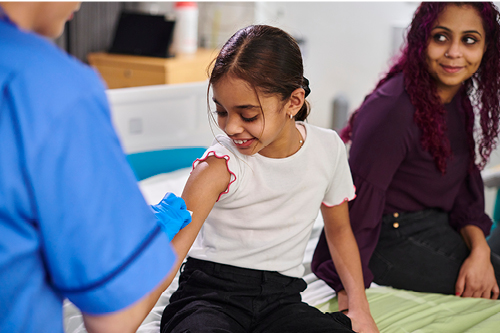 Child receiving an immunization shot.